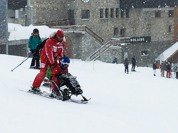 Josua Aspin sit skiing in Val d'Isere