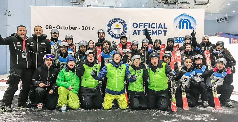 Group photo of the team of blind skiers and their support team at Ski Dubai