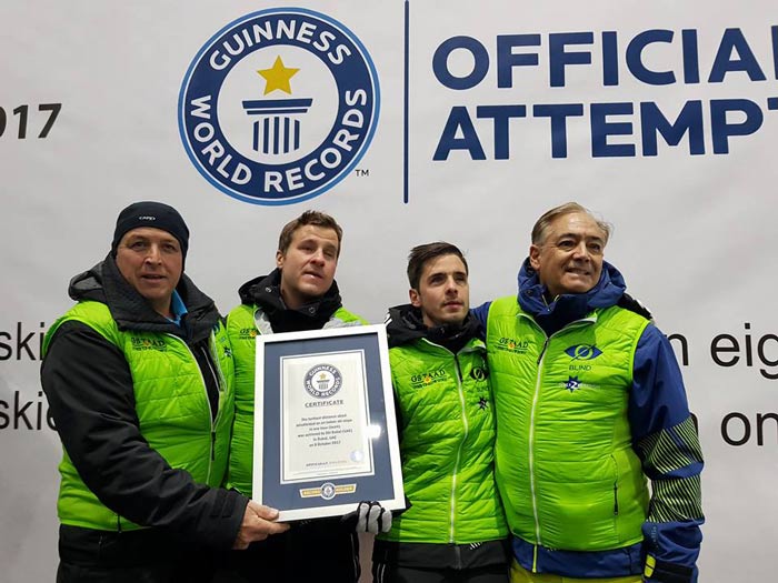 The blind skiers holding their world record certificate